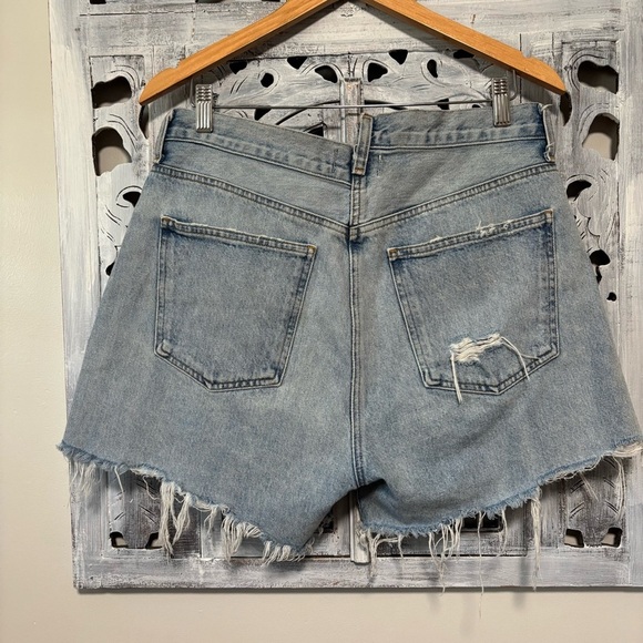 AGOLDE Criss Cross Symbol Medium Indigo Wash Asymmetrical Cutoff Jean Shorts - Picture 6 of 11